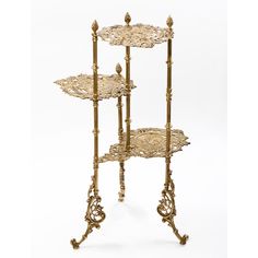 three tiered metal stand with ornate designs