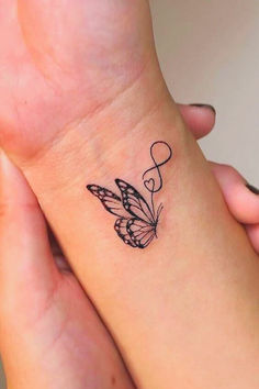 Butterfly Wrist Tattoo Design
#ButterflyTattoo #WristTattoo #ButterflyInk #TattooInspiration #BodyArt #ButterflyBeauty #TattooDesign #NatureTattoo #ButterflyLove #InkedButterfly #TattooedBeauty #TransformationArt #DelicateTattoo #ButterflyMagic 42 Tattoo, Butterfly Wrist Tattoo, Romantic Tattoo, Unique Small Tattoo, Hand Tattoos For Women, Tattoos Women, Small Butterfly