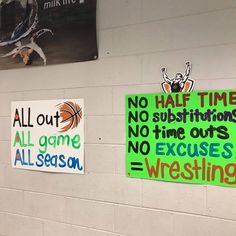 three signs are hanging on the wall in front of a basketball game sign and another sign that says no half time, no