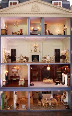 the inside of a doll house with furniture