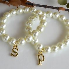 Stretch bracelet is made with 8mm glass pearls and gold plated letter of your choice. Elegant Pearl Bracelet With Letter Beads, Adjustable Gold Pearl Bracelet With Letter Beads, Initial Pearl Bracelet, White Heart-shaped Stretch Bracelet With Letter Beads, Gold Heart-shaped Pearl Bracelet For Valentine's Day, Gold Letter, Gold Letters, Stretch Bracelet, Pearl Bracelet