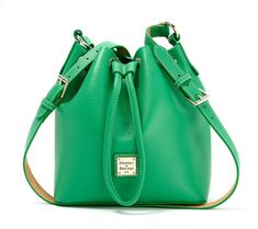 Take note: the Lucca drawstring crossbody lets you try fashion's hot modern prep aesthetic while relishing in timeless Dooney & Bourke craftsmanship. Grab the attractive pebble leather bag as a first-time purchase (finally!), an addition to your beloved collection, or a gift for the next generation (such a thoughtful auntie!). From Dooney & Bourke. Chic Pebbled Leather Crossbody Bucket Bag, Green Leather Bucket Bag For Spring, Luxury Leather Bucket Bag For Spring, Luxury Spring Leather Bucket Bag, Spring Textured Leather Bags, Spring Leather Crossbody Bucket Bag, Spring Leather Bucket Bag With Adjustable Strap, Pebbled Leather Crossbody Bucket Bag For Travel, Prep Aesthetic