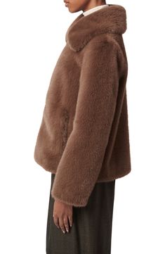 Bring a luxurious look to your cold-weather ensembles with this zip-front jacket crafted from plush faux fur and topped with an oversized collar. 25" length (size Medium) Front zip closure Spread collar Front welt pockets Lined 100% polyester faux fur Dry clean Imported Long Sleeve Mink Outerwear With Faux Fur Lining, Winter Faux Fur Coat With Zipper Closure, Faux Fur Coat With Zipper For Cold Weather, Faux Fur Long Sleeve Mink Outerwear, Mink Color Long Sleeve Faux Fur Outerwear, Mink-colored Long Sleeve Faux Fur Outerwear, Faux Fur Outerwear With Zipper, Faux Fur Outerwear With Zipper Closure, Faux Fur Outerwear With Zipper Closure And Long Sleeves