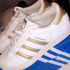 Adidas Superstars White With Gold Stripes.Size 5.5. Adidas Superstars, Adidas White, Shoes Adidas, Gold Stripes, White Adidas, Adidas Shoes, Adidas Women, Womens Shoes Sneakers, Shoes Sneakers