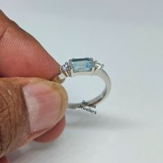 BAND - ROUNAK JEWELLERS MATERIAL - 925 STERLING SILVER GEMSTONE - 100% NATURAL AQUAMARINE AQUAMARINE STONE WEIGHT - 0.75 CARAT AQUAMARINE STONE SIZE - 4 x 6 MM SECONDARY STONE - CUBIC ZIRCONIA ZIRCONIA STONE WEIGHT - 0.15 CARAT ZIRCONIA STONE SIZE - 2.50 MM GROSS WEIGHT - 2.640 GM STONE SHAPE - BAUGETTE, ROUND GEM COLOUR - BLUE, WHITE RING SIZE - ALL SIZE AVAILABLE PLEASE GIVE YOUR OPENION OR FEEDBACK ABOUT THE PRODUCT. WE ACCEPT BULK ORDER ALSO. https://www.etsy.com/in-en/shop/RounakJewellers?r Stackable Emerald Cut Sterling Silver Rings, Adjustable Sterling Silver Topaz Ring With Accent Stones, Stackable White Gold Rings With Blue Topaz, Adjustable Blue Topaz Rings For Anniversary, Aquamarine Gem, Turquoise Accents, Aquamarine Ring, March Birthstone, Aquamarine Stone