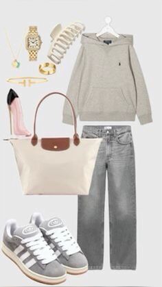 a woman's outfit with sneakers, handbag and purse