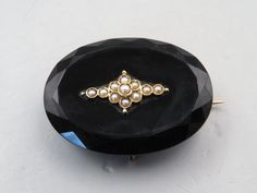 "Beautiful Victorian 14k Gold Faceted Black Onyx and Seed Pearl Mourning Brooch Pin. The pin is in excellent condition. It can also be worn on a chain as a pendant. It is 1 1/2\" long and 1\" tall. It can be worn as a pendant as well. It acid tested 14k gold" Luxury Black Brooch Jewelry, Luxury Black Jewelry Brooch, Luxury Black Brooch For Evening, Luxury Black Jewelry With Brooch, Antique Oval Brooches For Evening, Luxury Black Brooches For Formal Occasions, Antique Black Brooch For Evening, Antique Black Brooch For Gift, Vintage Black Brooch For Anniversary