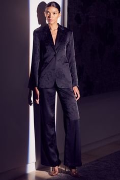 The Remi pant is cut from a black satin jacquard with floral tonal detailing throughout. These perfectly tailored pants feature a high rise and slightly flared leg. Banded waist with belt loops, zip fly and button tab closure. Complete the look with our coordinating Lauren blazer. Made in ChinaDry Clean90% Acrylic 10% Polyester Model Measurements: Height 5'10.5", Waist 24", Bust 32", Hips 35"Model is wearing size XS Fall Suit, Mesh Jumpsuit, Staple Dress, Cami Nyc, Long Sleeve Jersey, Fitted Blazer, White Bridal, Tailored Pants, Sweater Sale