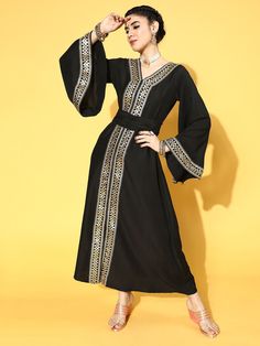 Buy beautiful black poly silk partywear ethnic motifs dresses online at best price from Inddus with free shipping. Elegant V-neck Dress For Navratri, Traditional Black Maxi Dress For Festive Occasions, Black Bollywood Style Dresses, Traditional Black Party Dress, Black Bollywood Dress, Traditional Black Floor-length Dress, Embroidered Evening Dress For Navratri, Black Bollywood Style Evening Dress, Elegant Maxi Dress For Navratri Party