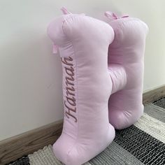 a pair of pink boots sitting on top of a rug