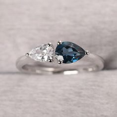 ◆ The ring is handcrafted from sterling silver and decorated with a dazzling 7*5 mm real London blue topaz and 6*4 mm CZ. It is suitable for engagement/anniversary/daily occasion. ◆ Production Description: Main stone Type: Real London blue topaz and CZ Main Stone Shape: Pear Cut Main Stone Size: 7x5 mm(0.96 ct) and 6x4 mm(0.65 ct) Side stone: None Metal: 925 Sterling silver - Other options available in the drop down menu ◆ Customization: √Free for Add Engraving √Other Metal Type Available √Other Sterling Silver Pear-shaped Ring For Anniversary, Sterling Silver Pear Shaped Ring For Anniversary, White Gold Sterling Silver Pear-shaped Ring, Pear Shaped Sterling Silver Anniversary Rings, Pear-shaped Sterling Silver Anniversary Ring, Pear Shaped White Gold Sterling Silver Rings, Pear-shaped White Gold Sterling Silver Ring, Silver Pear-shaped Diamond Promise Ring, Elegant Sterling Silver Pear-shaped Topaz Ring