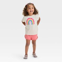 Fill your toddler's day with fun and excitement with this Short-Sleeve Rainbow Graphic T-Shirt from Cat & Jack™. Crafted from lightweight jersey fabric and featuring a tagless design, this short-sleeve T-shirt brings cool comfort to their day, while the below-waist length gives them the option of wearing it tucked in or untucked. Designed in a light beige hue, this crewneck tee features a rainbow graphic adorned with white flowers for cute style. Cat & Jack™: Designed for all children so you can Cute Multicolor T-shirt For Playwear, Cute Cotton T-shirt For Playdate, Playful Crew Neck Tops For Playdate, Multicolor Spring T-shirt For Play, Playful Short Sleeve T-shirt For Playdate, Playful Summer T-shirt For Playdate, Fun Cotton T-shirt For Playdate, Cute Summer Tops For Daycare, Multicolor Playful T-shirt For Playwear