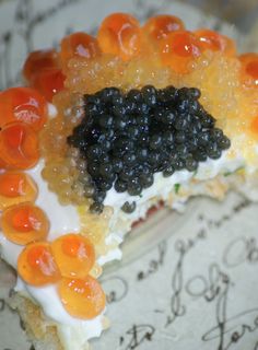 a piece of cake with blackberries and oranges on it