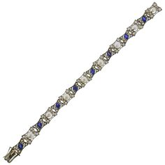 Antique 18k white gold bracelet, set with 8 natural pearls - measuring approx. 5.2mm to 6.2mm in diameter. Surrounded with blue stones and approx. mixed cut diamonds (rose and old/euro cut). Bracelet is 7" long and is 12mm wide. Marked 750 on the clasp tongue. Weight - 20.8 grams. Luxury Vintage Blue Bracelets, Formal Diamond Pearl Bracelet With Jubilee Style, Formal White Gold Multi-stone Tennis Bracelet, Elegant Blue Oyster Bracelet, Elegant Multi-stone Diamond Bracelet, Elegant Multi-stone Diamond Bracelets, Elegant Diamond Multi-stone Bracelets, Elegant Blue Diamond Bracelet, Silver Multi-stone Tennis Bracelet For Formal Occasions