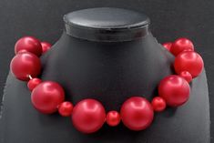 Vintage Deep Red Chunky Beaded Choker Necklace 1960's. Measures 18 1/2 inches long. In very good vintage condition. A nice addition to any collection. PS3 Party Large Beads Round Beaded Necklaces, Red Costume Jewelry Necklaces For Party, Retro Red Necklace For Party, Party Costume Jewelry Beaded Necklace With Large Beads, Party Costume Jewelry With Large Beaded Necklace, Party Costume Jewelry With Large Beads Necklace, Party-style Costume Jewelry With Large Beads, Party Costume Jewelry With Large Beads, Evening Single Strand Beaded Necklaces With Round Beads