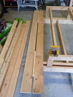 some wood is laying on the floor in a garage