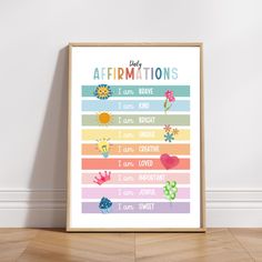 a poster with the words baby affirmitions on it in front of a white wall