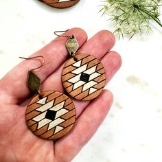 This listing is for one pair of round leather earrings with a geometric Aztec pattern. The base leather is a medium brown, and the accent colors are vintage white and black. These leather earrings are available in two sizes as shown in the pictures: 1. 2.25 inches in total length, 30 mm circle, antique bronze diamond connector 2. 2.5 inches in total length, 40 mm circle, antique bronze small circle connector **Hardware: -Ear wires and jump rings: antique brass, NICKEL FREE. **Packaging: Your ear Brown Geometric Earrings As Gift, Adjustable Southwestern Brown Earrings, Aztec Earrings Clay, Brown Geometric Earrings Gift, Rustic Brown Hand Tooled Earrings, Western Brown Hand-tooled Jewelry, Aztec Leather Earrings, Handmade Brown Geometric Earrings, Boho Macrame