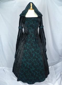 THIS DRESS WILL BE MADE TO YOUR MEASUREMENTS. PLEASE SEND ME YOUR BUST,WAIST AND HIP MEASUREMENTS AND ALSO PLEASE MEASURE FROM THE TOP OF YOUR SHOULDER TO THE FLOOR WITH SHOES. This dress will be made from beautiful black crushed velvet and Dark green with black jacquard fabric,it will have a corset style front and back with lacing. Combined shipping on multiple items. If you purchase express shipping by courier please send me your phone number thank you. Black Fitted Medieval Dress Costume, Medieval Black Long Sleeve Dress, Black Medieval Long Sleeve Dress, Medieval Long Sleeve Black Dress, Medieval Style Long Sleeve Black Dress, Green Fitted Medieval Dress, Gothic Green Dress For Costume Party, Green Gothic Dress For Costume Party, Black Medieval Evening Dress