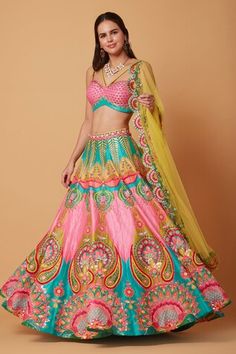 Pink and ocean electric green attached cancan lehenga with all over soul hearts bloom embroidery using multi thread, tonal sequins, beads and cut dana highlights. Paired with a criss cross sweetheart neck padded blouse with beaming little hearts embroidery and canary yellow net dupatta with artistic blossomy embroidered scallop border. - Aza Fashions Multicolor Sleeveless Wedding Set, Sleeveless Multicolor Lehenga For Wedding, Green Bohemian Choli For Reception, Bohemian Green Choli For Reception, Bohemian Green Designer Lehenga, Green Bohemian Dupatta For Reception, Green Bohemian Designer Lehenga, Green Lehenga With Motifs For Reception, Green Wedding Lehenga With Motifs