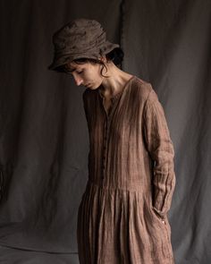 "Naturally dyed linen dress POEM This dress is made of 100% natural high-quality linen sackcloth -- loosely woven linen with alive visible texture. It has round neckline, button closure with tiny naturally dyed coconut tree buttons, side ties to adjust fit, side pockets. Neckline and sleeve hems are hand stitched with natural linen thread. Hem of the dress is unfinished. Total length is approximately 118cm / 46.4\". Each dress was hand dyed by madder, black tea, iron, alum to achieve dusty share Casual Long Sleeve Dresses With Natural Dye, Peasant Linen Dress With Long Sleeves, Long Sleeve Peasant Linen Dress, Bohemian Long Sleeve Dress In Natural Fiber, Bohemian Linen Dress For Daywear In Fall, Lagenlook Linen Dress With Long Sleeves, Bohemian Linen Dress For Fall Daywear, Bohemian Brown Linen Dress, Bohemian Linen Dress For Fall