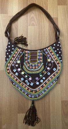 "Christiana Beautiful Multicolor Hand Beaded Large Hobo Shoulder Bag with Suede Leather Strap and Tassels  Made in India Zipper Closure, One Interior Zipper Pocket, Suede Leather Strap,  Condition is Used The exterior and interior are in very good condition. There's a few missing beads. Please use your zoom in option to view all the details. Length 13.5\" x Width 1\" x Height 14\" Strap handle drop 13\"" Holiday Mantle, Hobo Handbags, Bag Handle, Hand Beading, Leather Trims, Zipper Pocket, Suede Leather, Tassels, Purses And Handbags