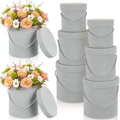 there are many flowers in the gray vases