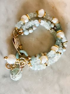 Faceted shades of the ocean colored gem stone beads mixed with natural pearls and gold accents. So pretty with a PAVE Rhinestone lobster claw closure. Elegant Amazonite Beaded Bracelets, Elegant Blue Amazonite Beaded Bracelets, Trendy Fashion Jewelry, Beaded Jewelry Designs, Multi Strand Bracelet, Colored Gems, Strand Bracelet, Gem Stone, Etsy Jewelry