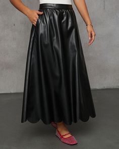 Upgrade your wardrobe with the Susana Pleated Leather Midi Skirt, the perfect piece for trendsetters who love a little edge with their elegance. Crafted from smooth faux leather, this skirt features gorgeous pleats and a scallop hem that adds a unique detail. With side slant pockets for a cool, laid-back vibe, it’s as functional as it is stylish. Whether you’re pairing it with the matching tank (sold separately) , a cozy sweater, or a sleek bodysuit, this midi skirt is the perfect selection. Smo Leather Midi Skirt, Scallop Hem, Swimwear Bottoms, Black Midi Skirt, Dresses By Length, Cozy Sweater, Wrap Sweater, Denim Pant, Sweater And Shorts