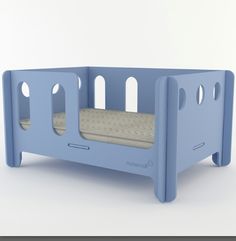 a blue toddler's bed with two mattresses on the bottom and sides