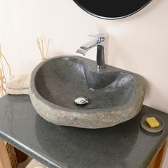 a bathroom sink sitting on top of a counter