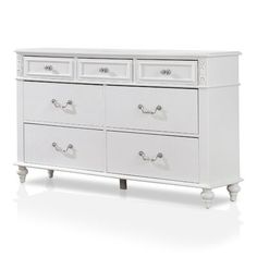 a white dresser sitting on top of a white floor