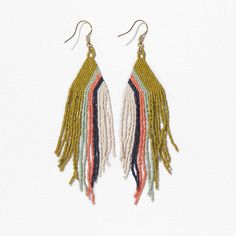 Our precision-cut glass Luxe beads in a daringly groovy colorway are just what your jewelry box is missing. Citron, mint, coral, navy + ivory beads are handwoven into a triangle shape with a modern diagonal stripe design that brings boho style to life in an approachable way. Flowy fringe takes these statement earrings to a whole new level with movement that turns heads with any outfit. Life is short - accessorize boldly. Citron, Mint, Coral + Navy Colors 4"L Made By Artisans In India Glass + Bra Unique Multicolor Geometric Jewelry, Modern Multicolor Geometric Jewelry, Adjustable Geometric Beaded Jewelry, Handmade Geometric Multicolor Jewelry, Handmade Multicolor Geometric Jewelry, Adjustable Triangle Beaded Earrings, Multicolor Beaded Geometric Earrings, Bohemian Triangle Jewelry With Dangling Beads, Adjustable Triangular Beaded Jewelry