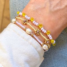 4mm mother of pearl beads; 8mm freshwater potato pearls; glass seed beads. Stretch style. Elegant Yellow Adjustable Beaded Bracelets, Adjustable Yellow Oval Beaded Jewelry, Elegant Yellow Bracelets For Spring, Pastel Bracelets, Bracelets Dainty, Pastel Bracelet, Bracelets Beaded, Flowers Yellow, Women's Bracelets