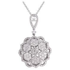 A real 1.80-carat pave diamond floral design pendant necklace, meticulously crafted in 18-karat white gold. The pendant delicately hangs from an 18-karat white gold chain. Item Code :- CNF-22029 Gross Wt. :- 4.79 gm 18k Solid White Gold Wt. :- 4.43 gm Natural Diamond Wt. :- 1.80 Ct. ( AVERAGE DIAMOND CLARITY SI1-SI2 & COLOR H-I ) Pendant Size :- 37.45 x 23.02 mm approx. Necklace Size :-17 inches Long ✦ Sizing ..................... We can adjust most items to fit your sizing preferences. Most items can be made to any size and length. Please leave a note at checkout or contact us via 1stDibs conversation. Even after purchasing the item, you can still ask us to adjust the size or length. We will try our best to fix it if it is possible. ✦ Import Duties, Taxes and Custom Charge ............... Floral Pendant Necklace, White Gold Chain, White Gold Chains, Floral Pendant, Necklace Sizes, Diamond Clarity, Pave Diamonds, Or Rose, Natural Diamonds