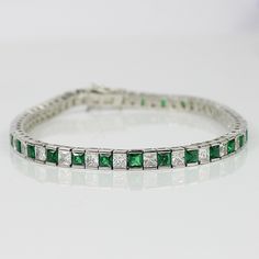 WHITE GOLD FINISH Green Emerald Princess Cut Alternating Created Diamond Bracelet | Birthday, Anniversary, Party, Wedding, Gift This beautiful created diamond bracelet is made as the perfect gift for a loved one! Either for yourself, a friend, or a dear one, this bracelet is made with love, compassion and care, just for you! The Emerald possess healing properties along with protective qualities which allow complete stimulation and restoration of the mind, body and spirit. We all have a different level of relationship with ourselves and this relationship allows us to harness the powers of the Emerald which could be used to cleanse an individual's soul including the people around them. If you have mastered the art of controlling the energy flows within the body then you can easily leverage t Thread Bangles, Bangles Design, White Gold Bracelet, Wedding Jewelry Bracelets, Princess Diamond, Emerald Stone, Anniversary Party, Green Emerald, Online Jewelry Store