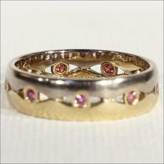 There are some pieces that I really wouldn't mind keeping in my permanent collection. This fantasy of a ring appeals to my girly side. It's half yellow gold and half white gold and set around it are nine very glittery pink diamonds. Two colors of gold playing with pink, the perfect stacking ring, makes me swoon just a bit! This vintage ring was hand crafted around 1970 and has just one mark of '585' indicating it's 14 karat gold content. The diamonds are about .03 carats each for about .36 carat Memorial Ring, Pink Diamonds, White Gold Band, Anniversary Bands, Spring Green, Vintage Ring, Stacking Ring, Pink Diamond, Vintage Yellow