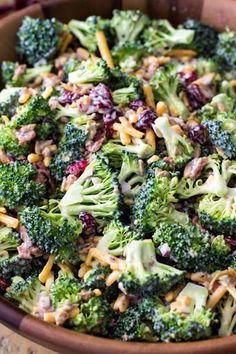 broccoli salad with cranberries and cheese in a bowl