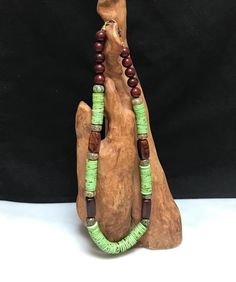 GREEN ETHNIC NECKLACE:  Funky.  Boho.  Nepalese bone button disks, Dzi rondelles, wood barrels and rosewood deep red round beads.  Striking, fun, statement piece.  I wanted to make green necklaces for all hair colors and complexions . . .  not just redheads.  I hope this works for you. Green Necklaces, Bone Bead Necklace, Funky Necklace, Unusual Necklace, Diy For Men, Ethnic Necklaces, Bone Beads, African Jewelry, Green Necklace