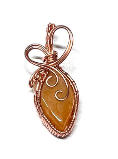 One of a kind, beautiful wire wrapped stones, set in pure copper. Elegant Hand Wrapped Copper Jewelry, Elegant Brown Copper Wire Jewelry, Elegant Wire Wrapped Copper Wire Jewelry, Gold Copper Wire Jewelry With Gemstones, Gold Gemstone Jewelry With Copper Wire, Elegant Copper Wire Jewelry For Gifts, Hand Wrapped Rose Gold Copper Jewelry, Orange Wire Wrapped Handmade Jewelry, Wire Wrapped Copper Jewelry Gift