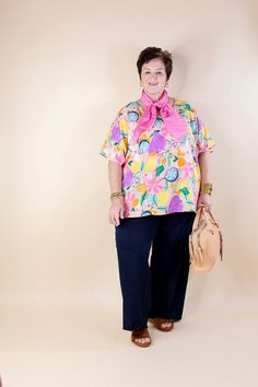 Elevate your style to a whole new level with our "Majestic Moment" poncho top. Bursting with charm, this top boasts a delightful fruit and floral print in vibrant spring colors, adding a touch of whimsy to any ensemble. The poncho silhouette offers an oversized fit, ensuring comfort without compromising on style. With drop sleeves and a chic V-neckline, it effortlessly combines fashion and flair. Step into the spotlight and make every moment majestic with this statement piece. Available in sizes Fruit Print Tops For Beach In Spring, Spring Pink Tops With Fruit Print, Pink Fruit Print Tops For Spring, Multicolor Fruit Print Tops For Spring, Multicolor Fruit Print Spring Top, Oversized Pink Floral Print Top, Frilly Top, Poncho Top, Giddy Up Glamour