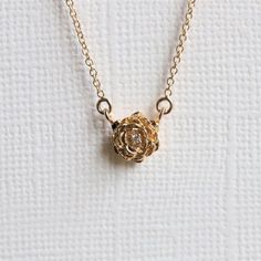 "Feminine and elegant, this necklace is for anyone who loves roses or any flowers. A delicate and beautiful rose pendant set with a sparkly diamond in the center hangs from an adjustable 16-18\" 1 mm cable chain.  It is also the perfect match to our ROSE ring available here >> https://etsy.me/35JCoHk ❁❁ I T E M ∙ D E T A I L S ❁❁ ✦Stone： Natural Diamond Shape： Round Size: 1 mm x 1 Quality: VS, F-G ✦ Pendant: Metal Type: Choice of solid 14K Gold with 20 gauge jump ring Metal Color: Rose / White / Luxury Rose Gold Necklace With Flower Charm, Round Gold Necklace, Fantasy Things, Bangles Design, Rose Pendant, Rose Necklace, Original Jewelry, Beautiful Rose, Gorgeous Jewelry