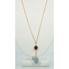 This is part of Chairish’s Fine Jewelry assortment.  METAL: 14k yellow gold WEIGHT: 16.4 grams STONES: Aquamarine, Ruby TOTAL CARAT WEIGHT: 15.4 cts  Aquamarine & Ruby Cabochon Necklace. This necklace is made from an antique watch chain and features a two stone drop. One stone is an aquamarine cabochon with a color grade of grayish blue and a weight of 9.29 carats. The second stone is a ruby cabochon with a color grade of bright red and a carat weight of 6.11.  This Aquamarine & Ruby Cabochon Ne 14k Gold Cabochon Necklace Fine Jewelry, Formal Jewelry With Oval Cabochon Natural Stones, Formal Oval Pendant With Natural Stones, Formal Oval Cabochon Natural Stone Jewelry, Yellow Gold Multi-stone Oval Pendant Jewelry, Gold Multi-stone Oval Cabochon Jewelry, Gold Multi-stone Oval Pendant Jewelry, Gold Oval Cabochon Multi-stone Jewelry, Formal 14k Gold Jewelry With Natural Stones