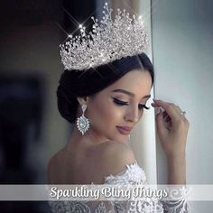 a beautiful woman wearing a tiara and earrings