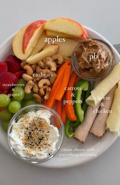 a white plate topped with fruits and vegetables