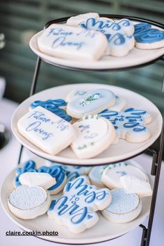 two tiered trays holding cookies with blue and white icing