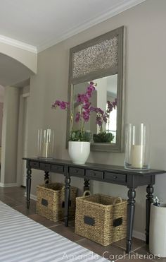 a table with baskets and flowers on it