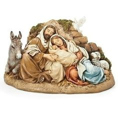 the nativity figurine is displayed on a white background