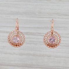 Gem: Natural Diamonds - 0.12 Total Carats, Round Brilliant Cut, F - G Color, VS2 Clarity - Natural Morganites - 0.98 Total Carats, Round Brilliant Cut, Pink Color Metal: 14k Rose Gold Weight: 3.3 Grams Stamps: 14k Closure: Hook Posts & Lever Backs Measurements: 21 x 12.8 mm Each piece is thoroughly examined and refinished as needed by our professional jewelers, graded by our in-house GIA (Gemological Institute of America) Graduate Gemologist, and inspected for quality before being carefully Pierced Round Rose Gold Diamond Earrings, Diamond Halo Earrings, Halo Diamond Earrings, Morganite Diamond, Filigree Jewelry, Halo Earrings, Recycled Jewelry, Heart Pendant Diamond, Message Jewelry