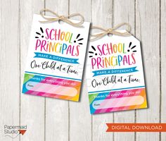 two back to school printables are hanging from twine strings on a wooden background